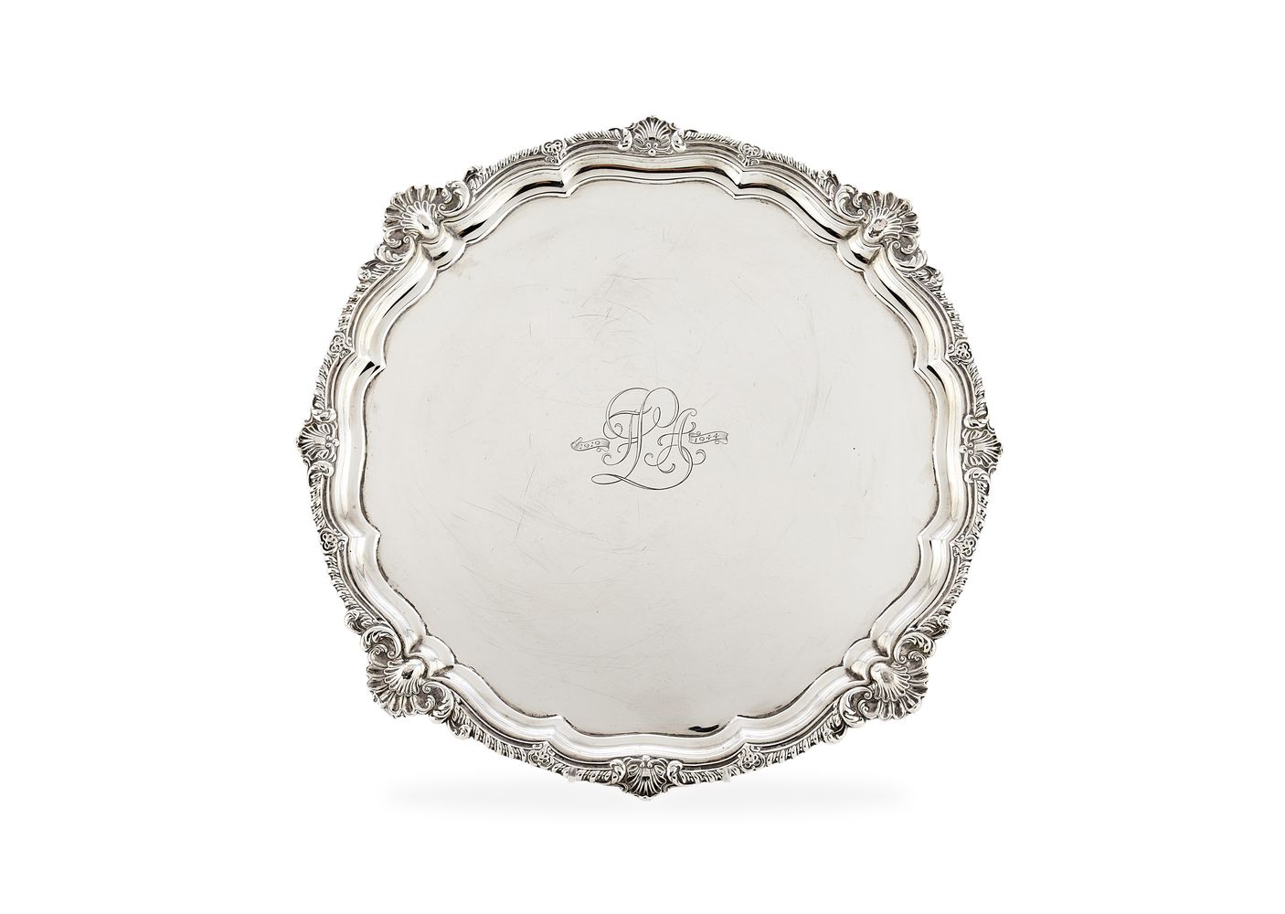 A large Edwardian silver shaped circular salver by Harrison Brothers & Howson