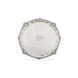 A large Edwardian silver shaped circular salver by Harrison Brothers & Howson