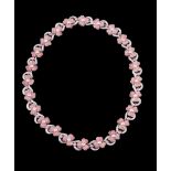 A pink sapphire and diamond flower head necklace