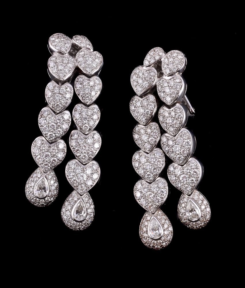 A pair of diamond ear pendants