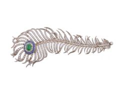 A diamond, emerald and sapphire peacock feather brooch