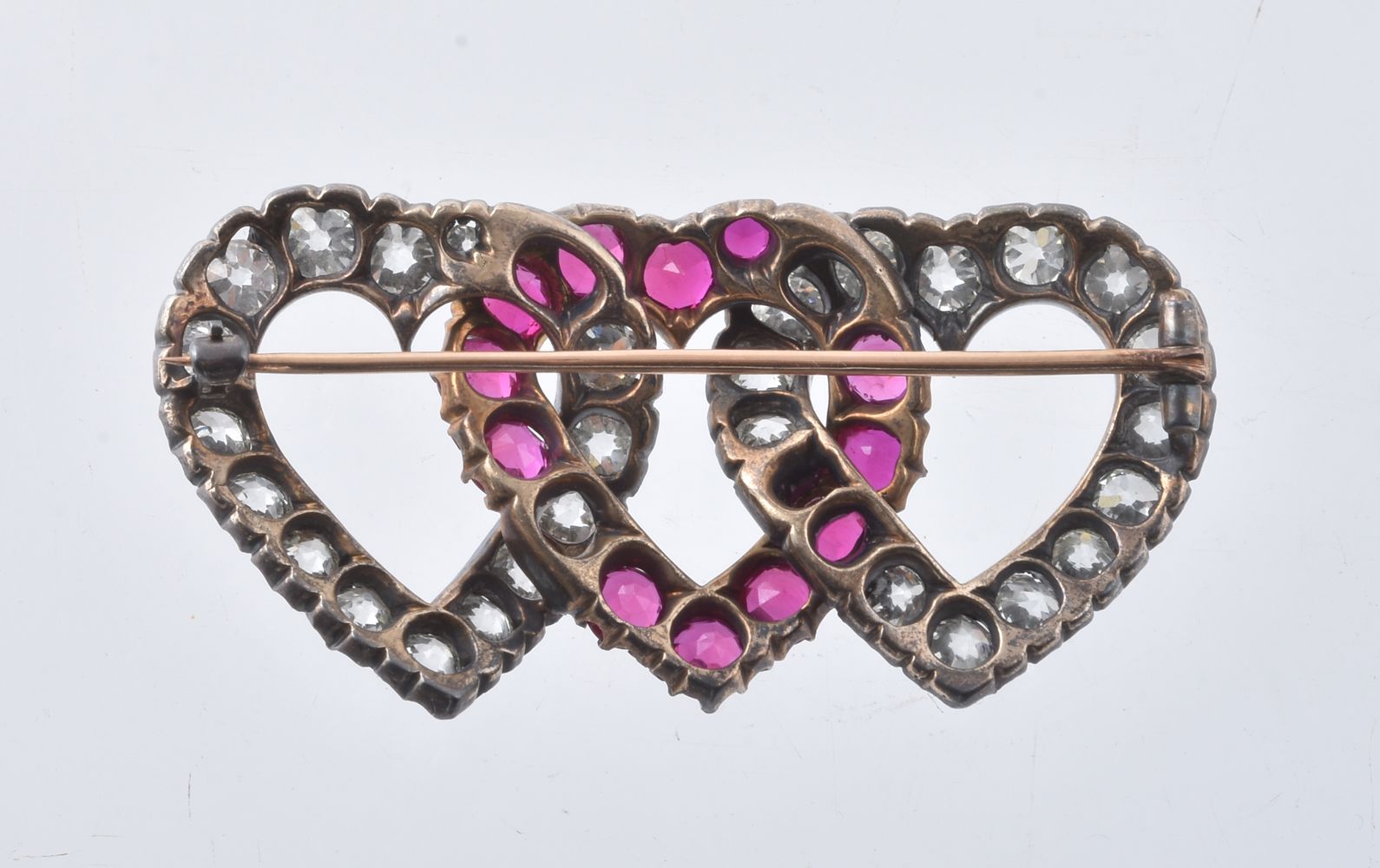 A late 19th century diamond and synthetic ruby triple heart brooch - Image 2 of 2