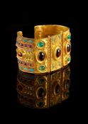 ϒ A gold coloured multi gem set bangle by Natalia Josca