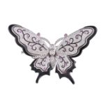 A diamond, pink sapphire and black enamel butterfly clip brooch