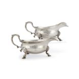 A pair of George II silver oval sauce boats by John Pollock