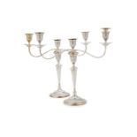 A pair of silver three light circular candelabra by Mappin & Webb