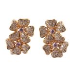 A pair of diamond and pink diamond flower head ear clips