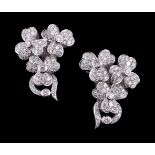 A pair of diamond floral spray earrings