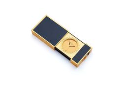 S.T. Dupont, a Chinese lacquer and gold plated travel alarm clock in the form of a lighter