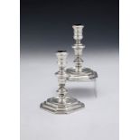 A matched pair of cast Britannia standard silver candlesticks