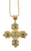 An emerald cross pendant necklace by Natalia Josca