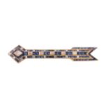 A sapphire and diamond arrow brooch