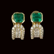 A pair of diamond and emerald earrings