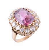 A pink spinel and diamond cluster ring