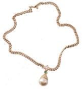 A South Sea cultured pearl, emerald and diamond pendant