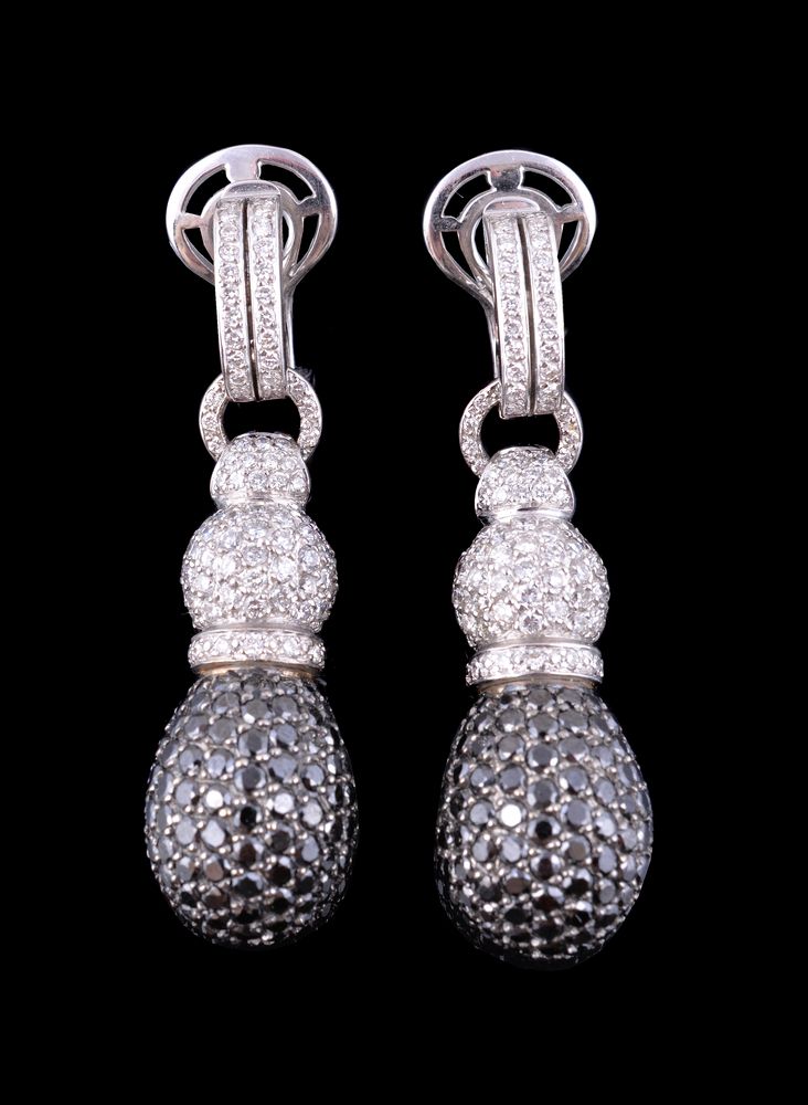 A pair of diamond and black diamond ear pendants