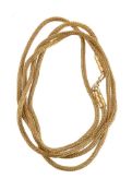 A handmade gold coloured foxtail link necklace by Natalia Josca the chain composed of woven gold col