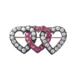 A late 19th century diamond and synthetic ruby triple heart brooch