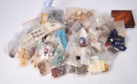 A group of loose gemstones and other items