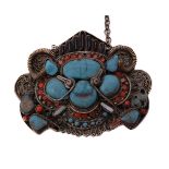 A Tibetan/Newari monster mask pendant