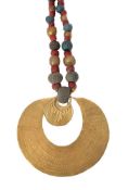 An Egyptian style composite turquoise and coral coloured faience and glass bead necklace