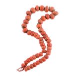 ϒ A single strand coral bead necklace