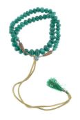 A dyed green beryl bead necklace