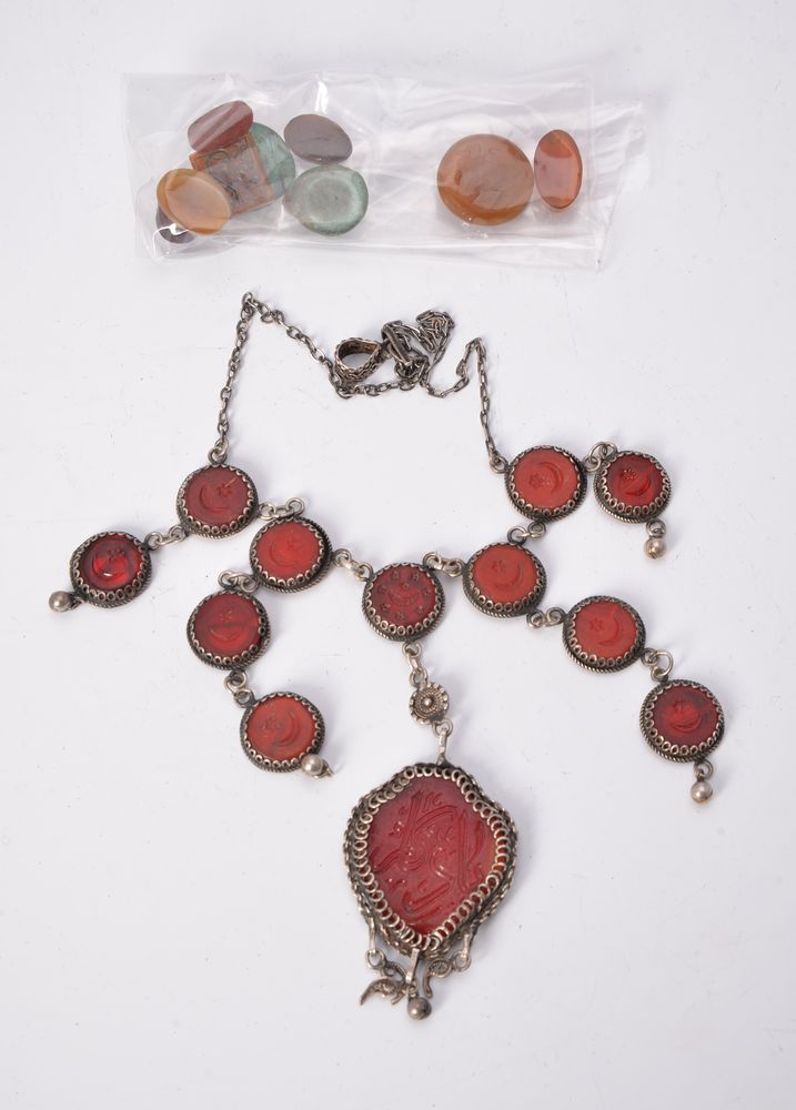 An Islamic glass intaglio necklace