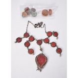 An Islamic glass intaglio necklace