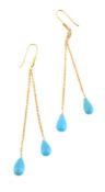 A pair of turquoise earrings