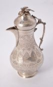 An Egyptian silver coloured baluster coffee pot
