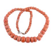 ϒ A single strand coral bead necklace