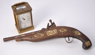 A brass repeating carriage clock