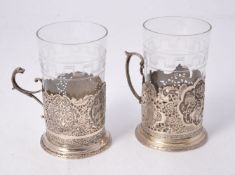 Two Persian silver tea glass holders