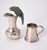 A Mexican silver jug with parrot handle by Carlos Castillo