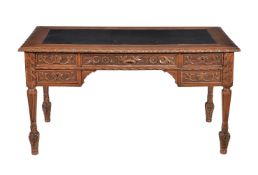 A Continental carved oak desk