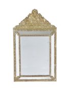 A embossed brass marginal wall mirror