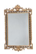 A carved gilt and ebonised framed wall mirror in George II style