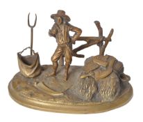 A French gilt bronze encrier modelled with a harvester