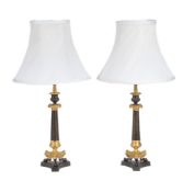 A pair of parcel gilt and lacquered metal table lamps