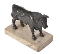 A patinated bronze model of a bull