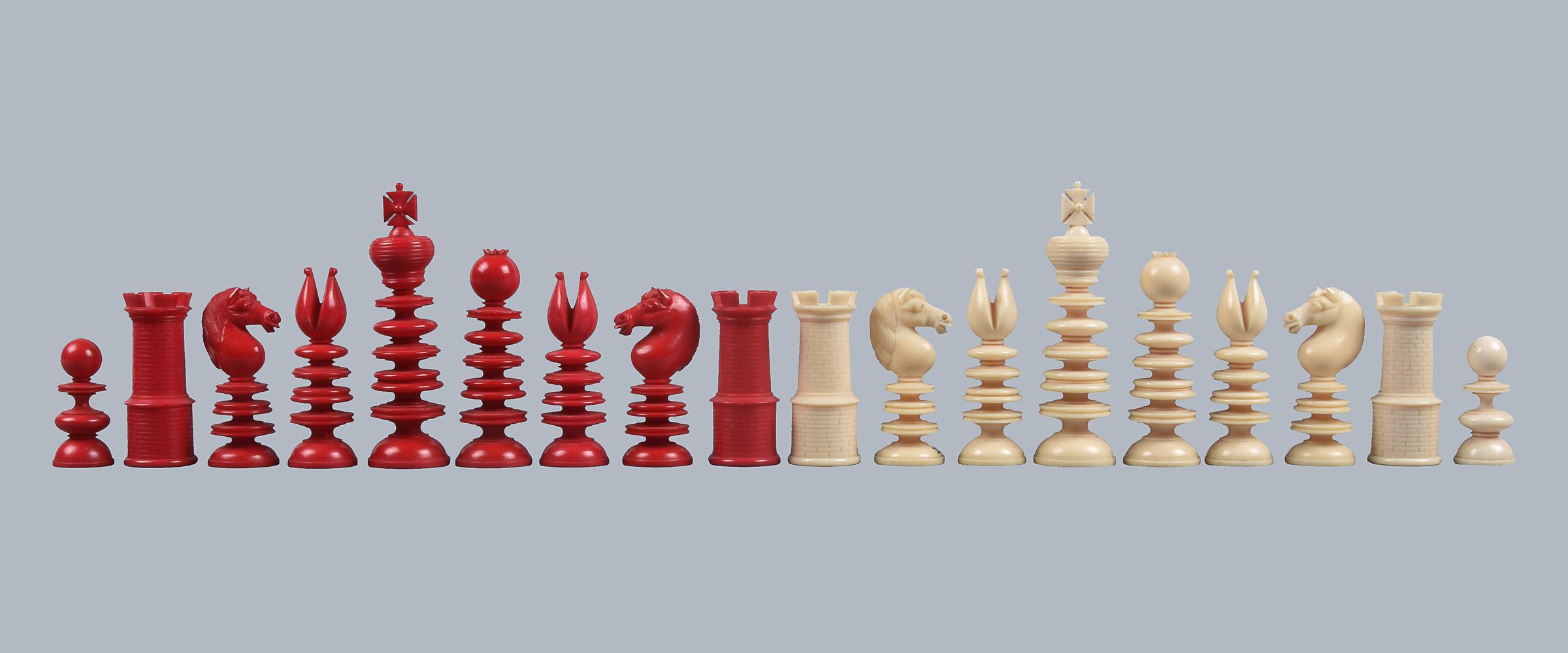 ϒ A fine and large turned ivory St George pattern chess set