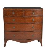 A George III mahogany and plum pudding mahogany chest of drawers