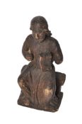 A Mediaeval carved and stained oak figure of a seated female saint