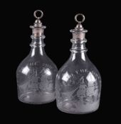 A pair of engraved commemorative club-shaped decanters of nautical interest