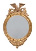 A carved giltwood wall mirror in Regency taste