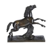 A patinated bronze model of a leaping horse
