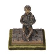 A Continental bronze model of a vagabond boy