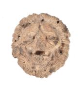 A Roman carved bone lion's mask