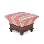 A George IV carved oak and upholstered ottoman footstool